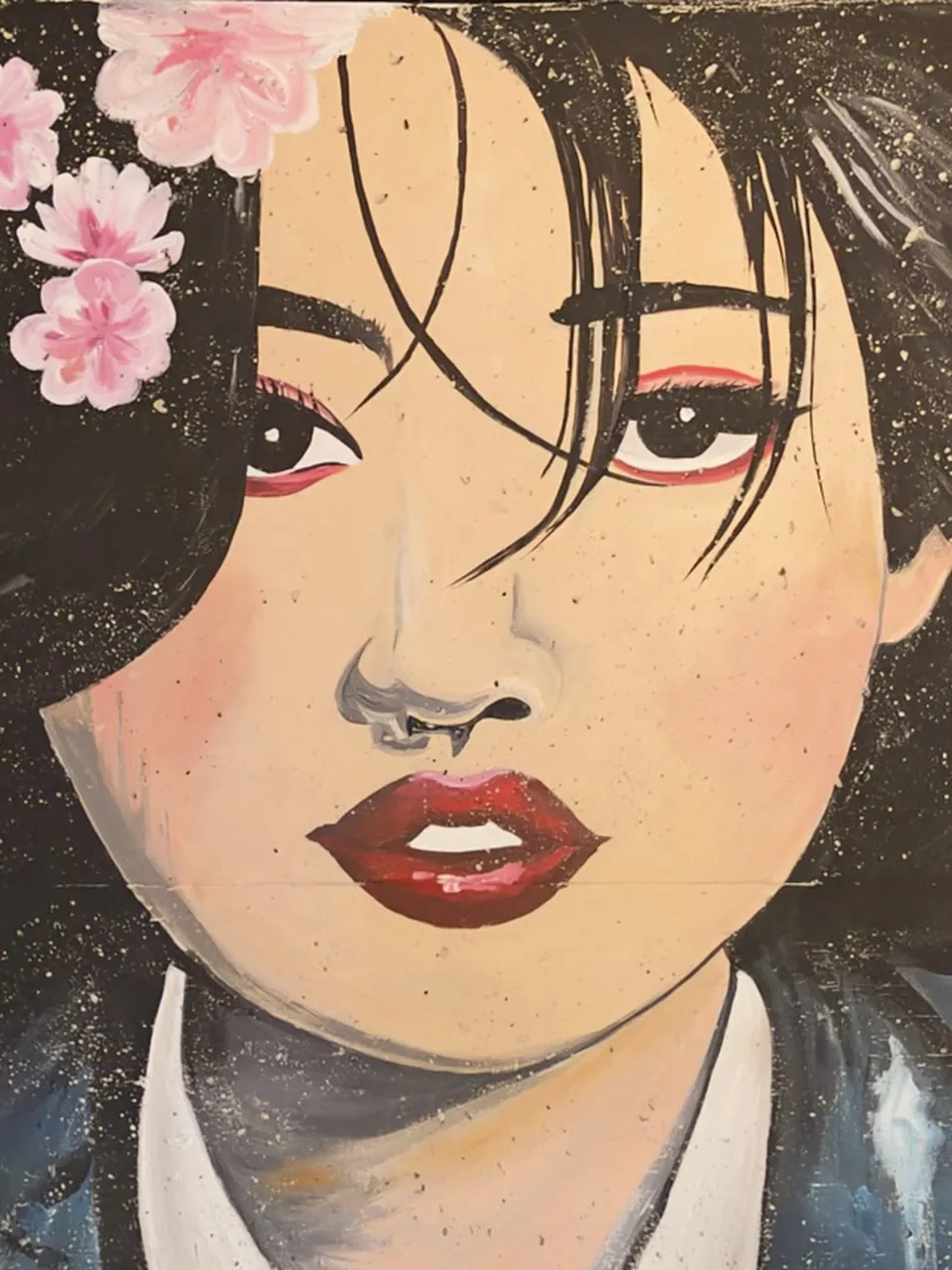 Hand-painted mural of a girl with cherry blossoms in her hair, who peeks through her windblown hair, pokes her tongue out, laughs and winks